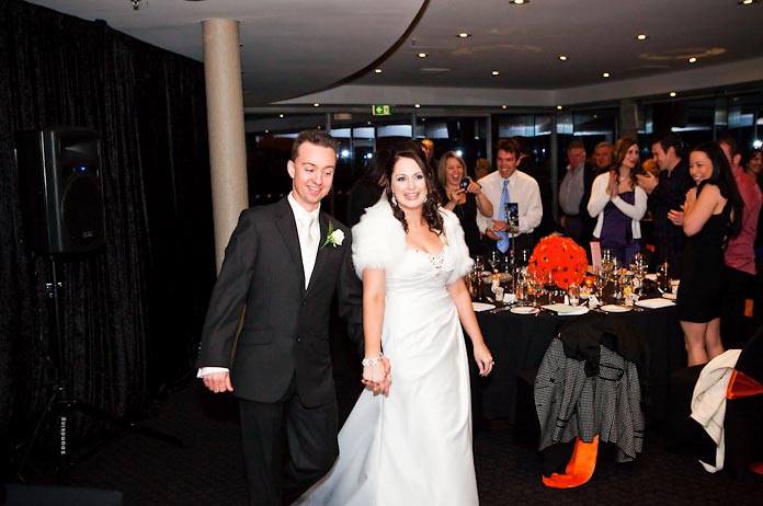 Bride and groom entrance-orange wedding theme