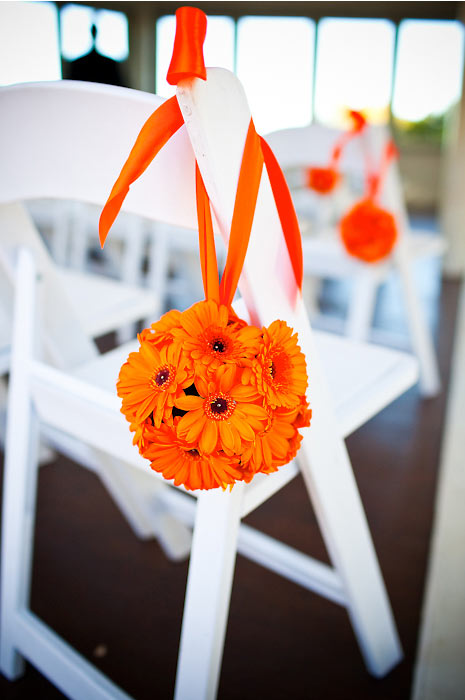 Ceremony chair with orange flowers