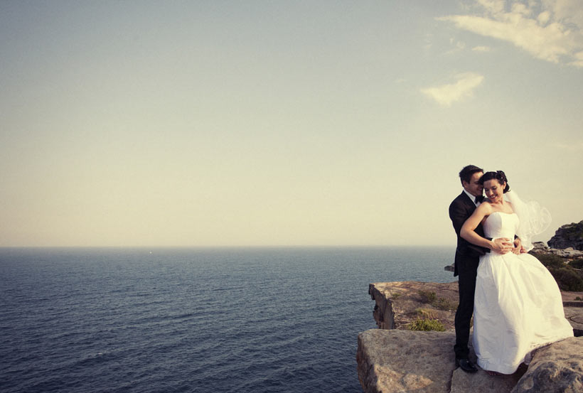 Wedding couple on cliff