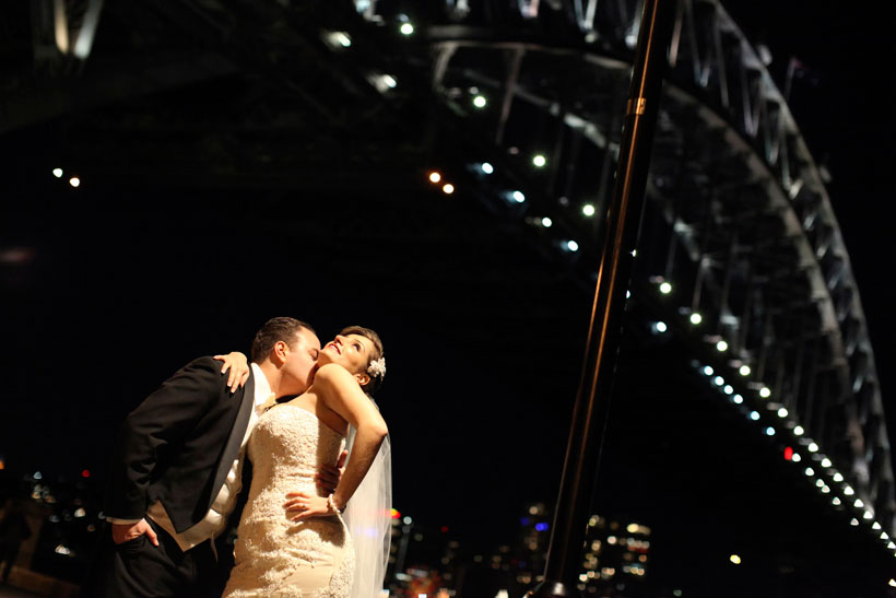 Bride and groom under the Harbour Bridge