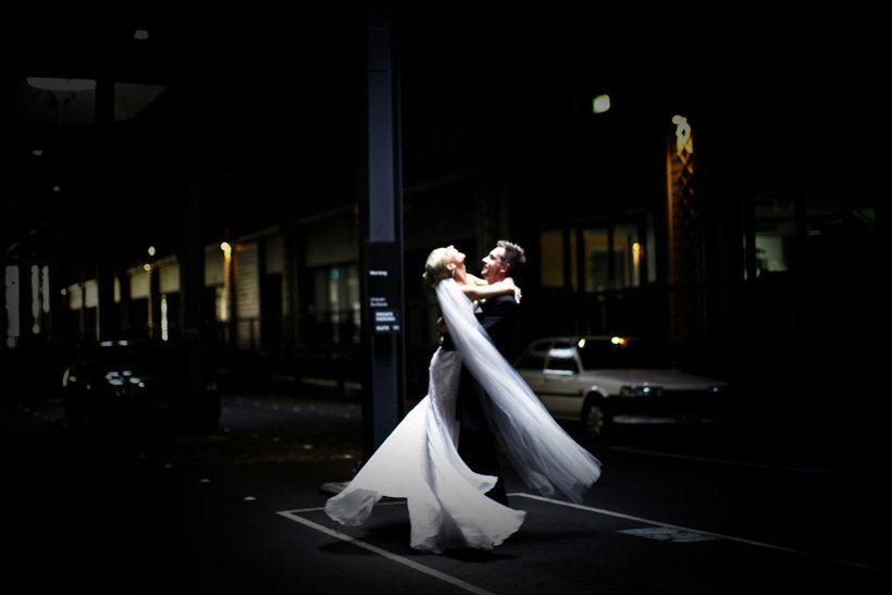Bride and groom dancing in the night