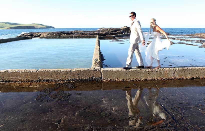 Beach wedding- bride and groom at pool