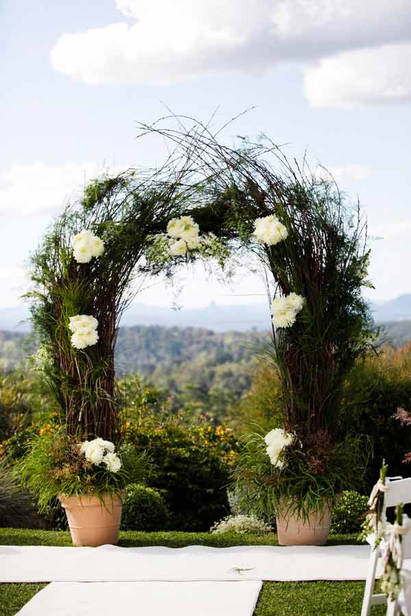 Wedding ceremony arch with flowers