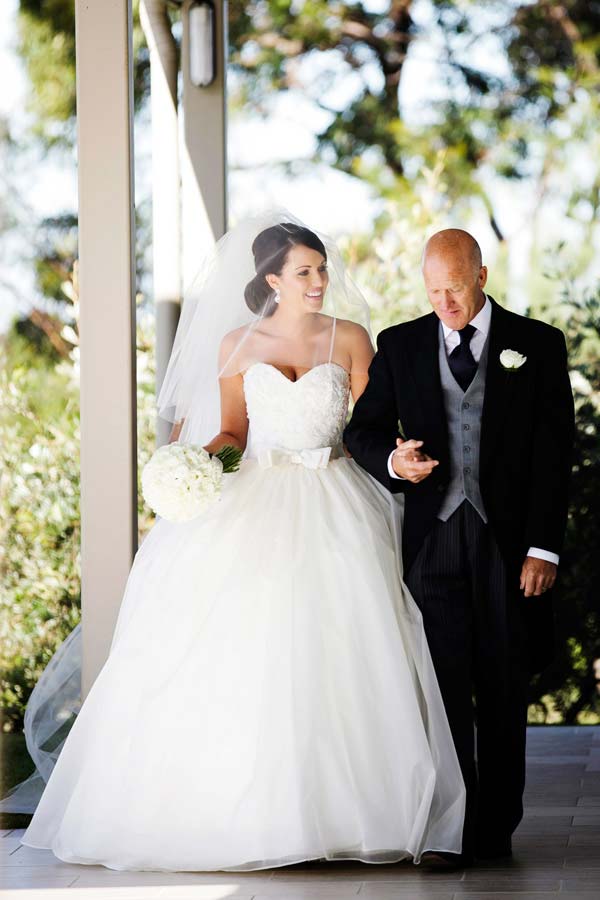 Bride and father walking down aisle