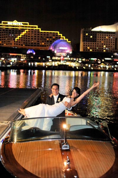 Sydney Wedding- bride and groom leaving on a boat