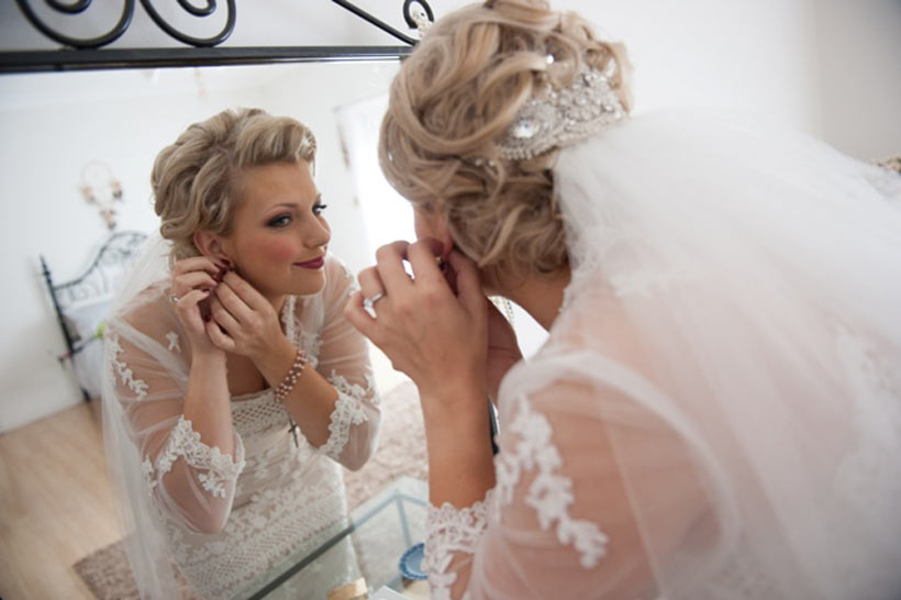 The beautiful bride finalising her preparations 