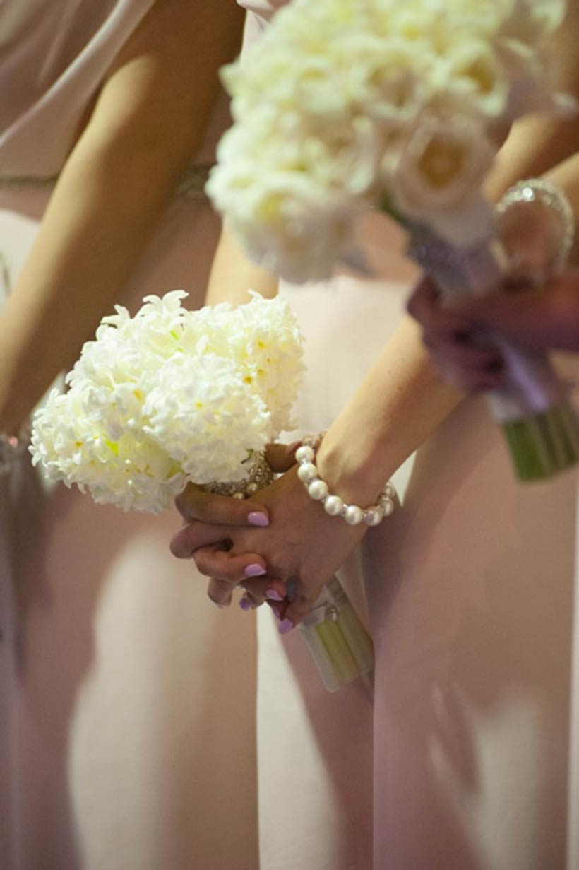 The beautiful interplay of the pink bridesmaid dresses and white bouquets