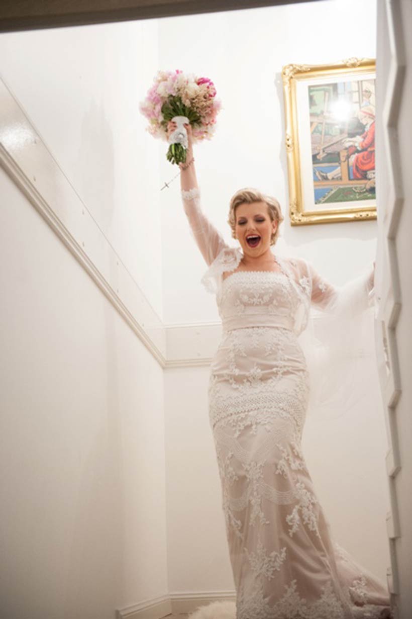 The bride triumphantly emerges