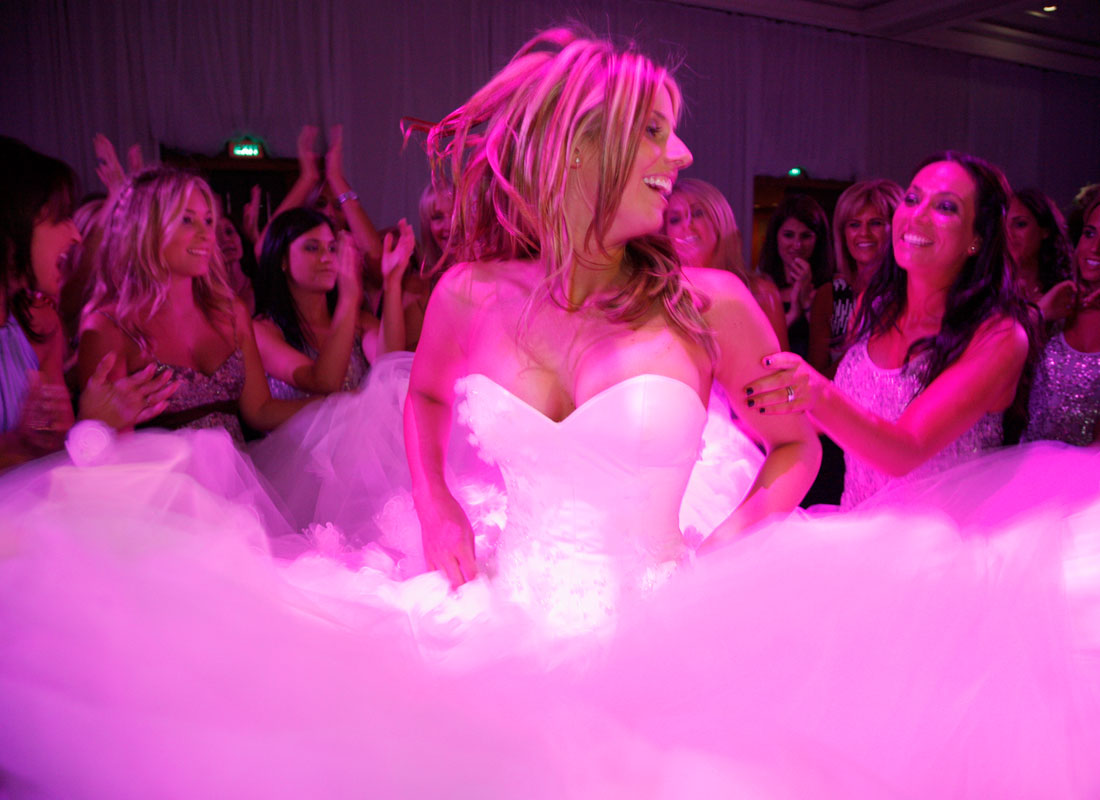 Bride dancing at pink reception