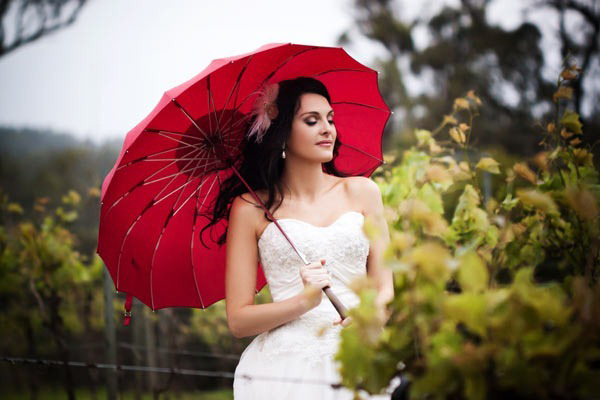 bride with a red umbrella