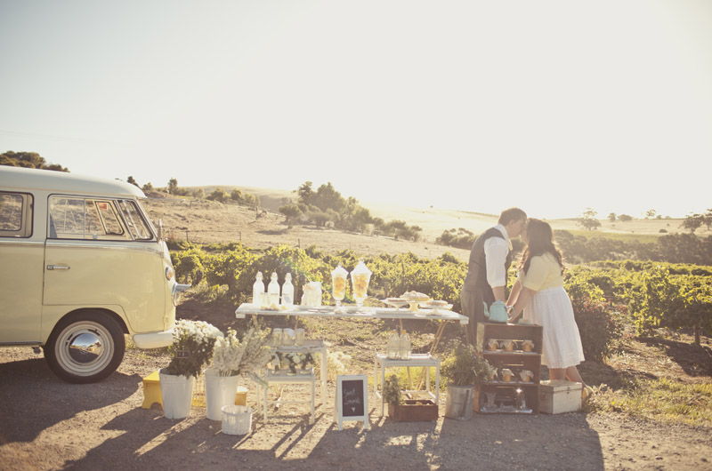Bride and Groom with lemonade stand and combi van