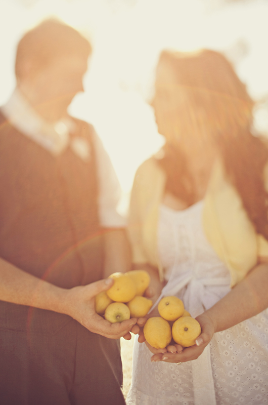 Bride and groom with lemons for engagement shoot