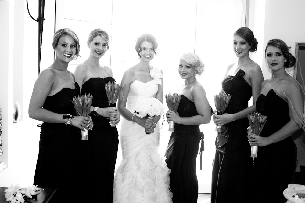 Bride with bridesmaids in black