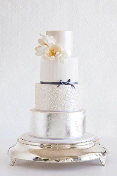 Multi tiered metallic wedding cake