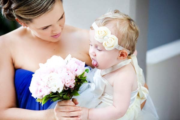 Bridesmaid with pink bouquet and blue dress