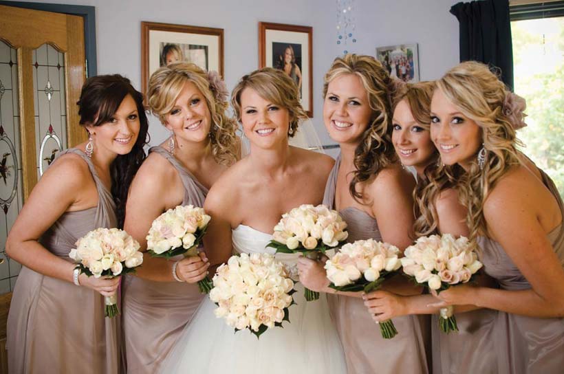 The bride and bridesmaids for a winery wedding