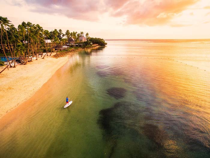 Fiji Drone over paddleboard at sunset by Michael Matti
