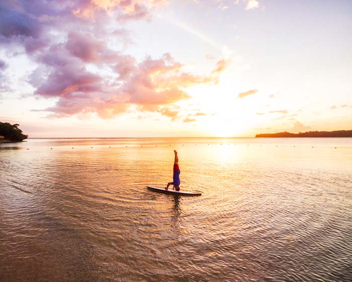 Fiji Standup Paddleboarding headstand by Michael Matti