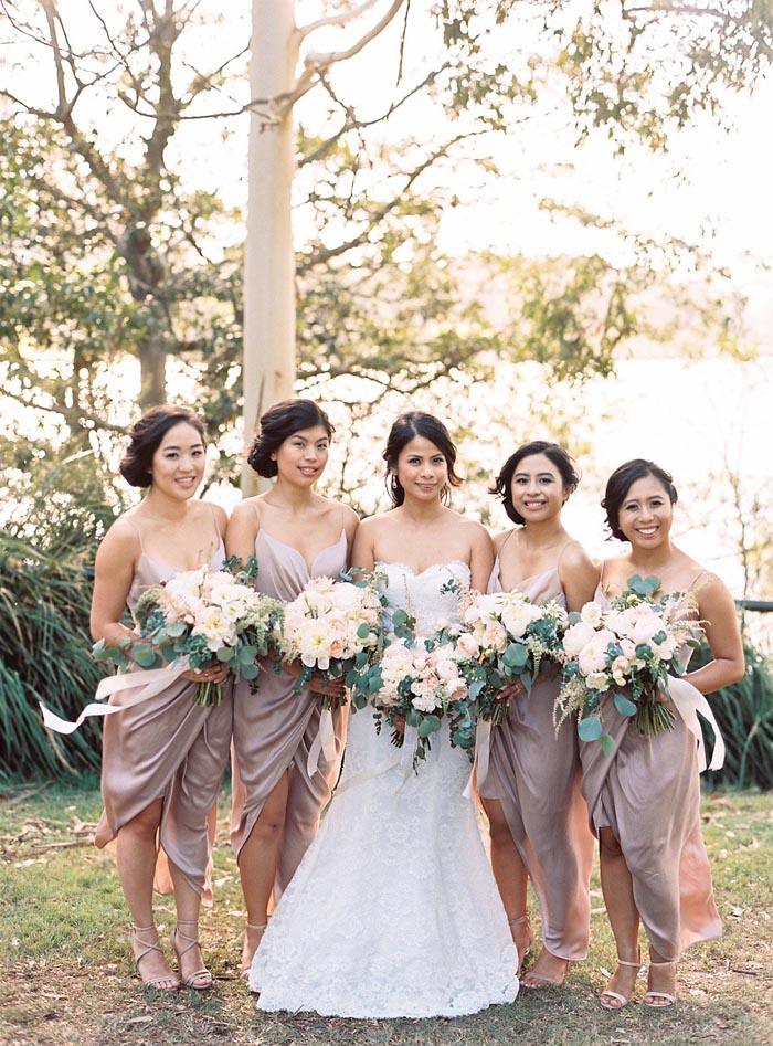 bride and bridesmaids in nude dresses