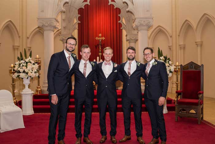 groom and groomsmen at church