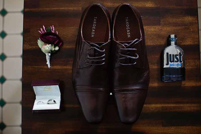 groom’s shoes and boutonniere