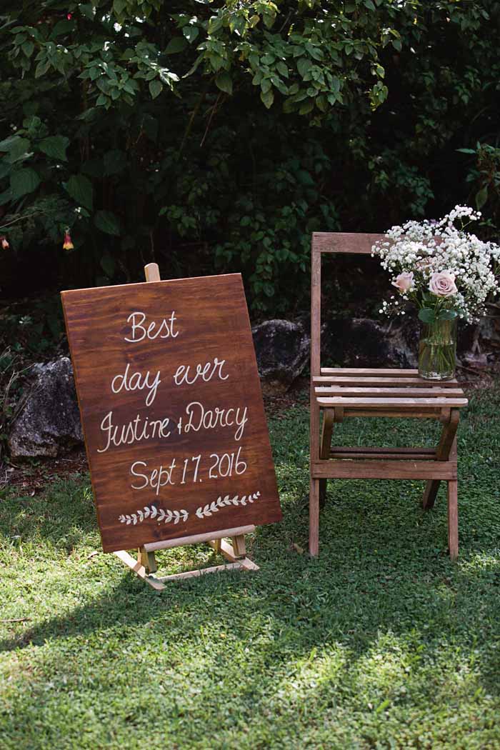 rustic outdoor wedding ceremony sign