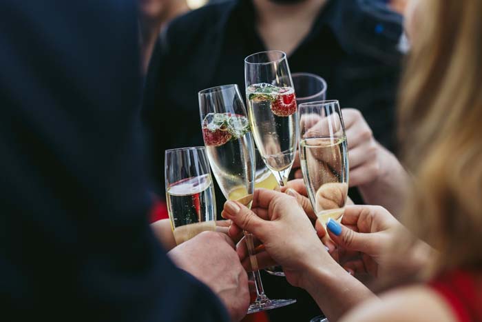 champagne to cheers at wedding after speech