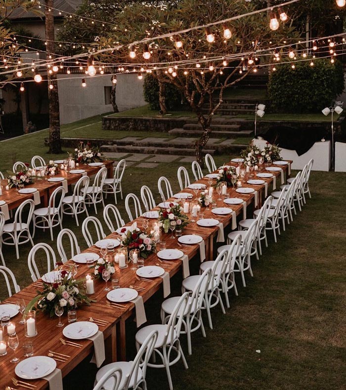 long rectangular wedding tables and festoon lighting